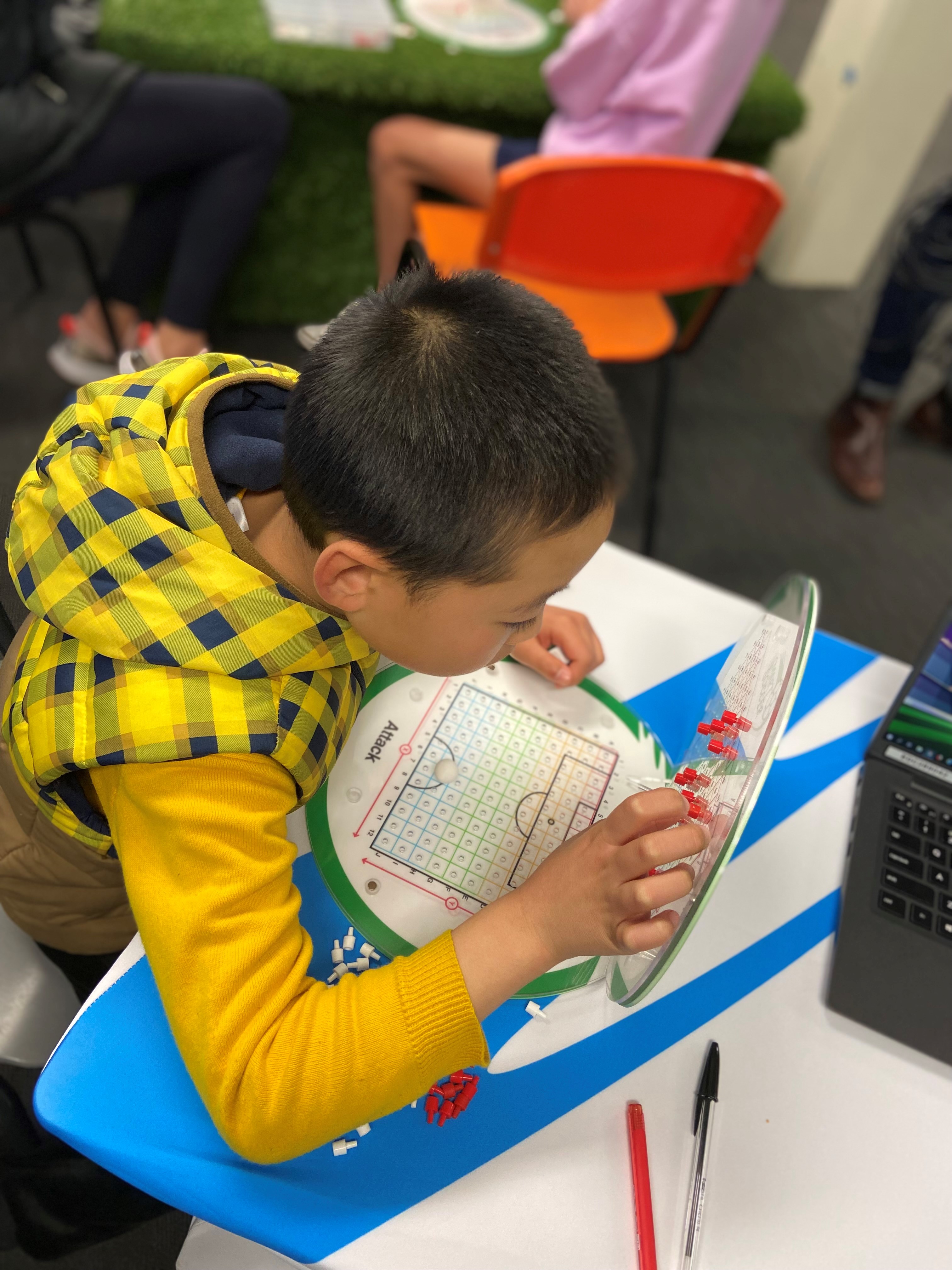 Student using a quick reflection checklist after activity